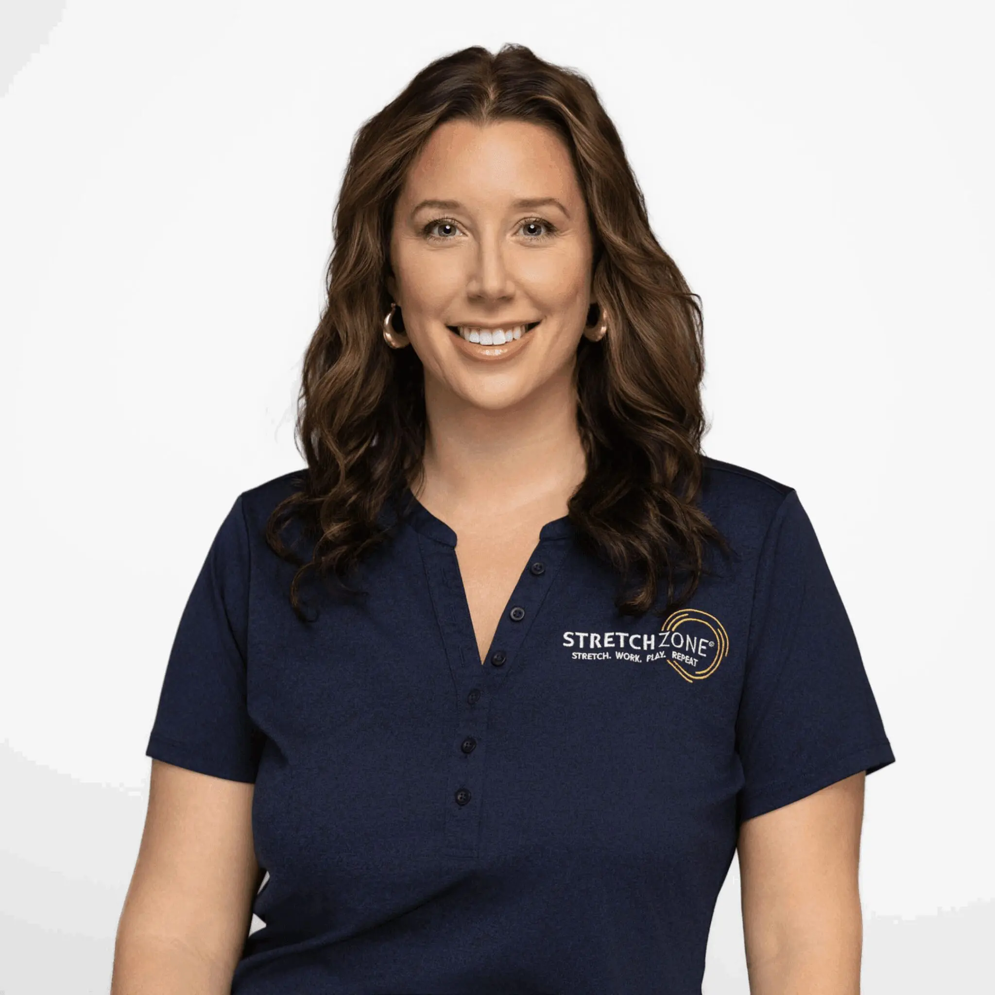 Smiling woman wearing a navy blue polo with a logo.