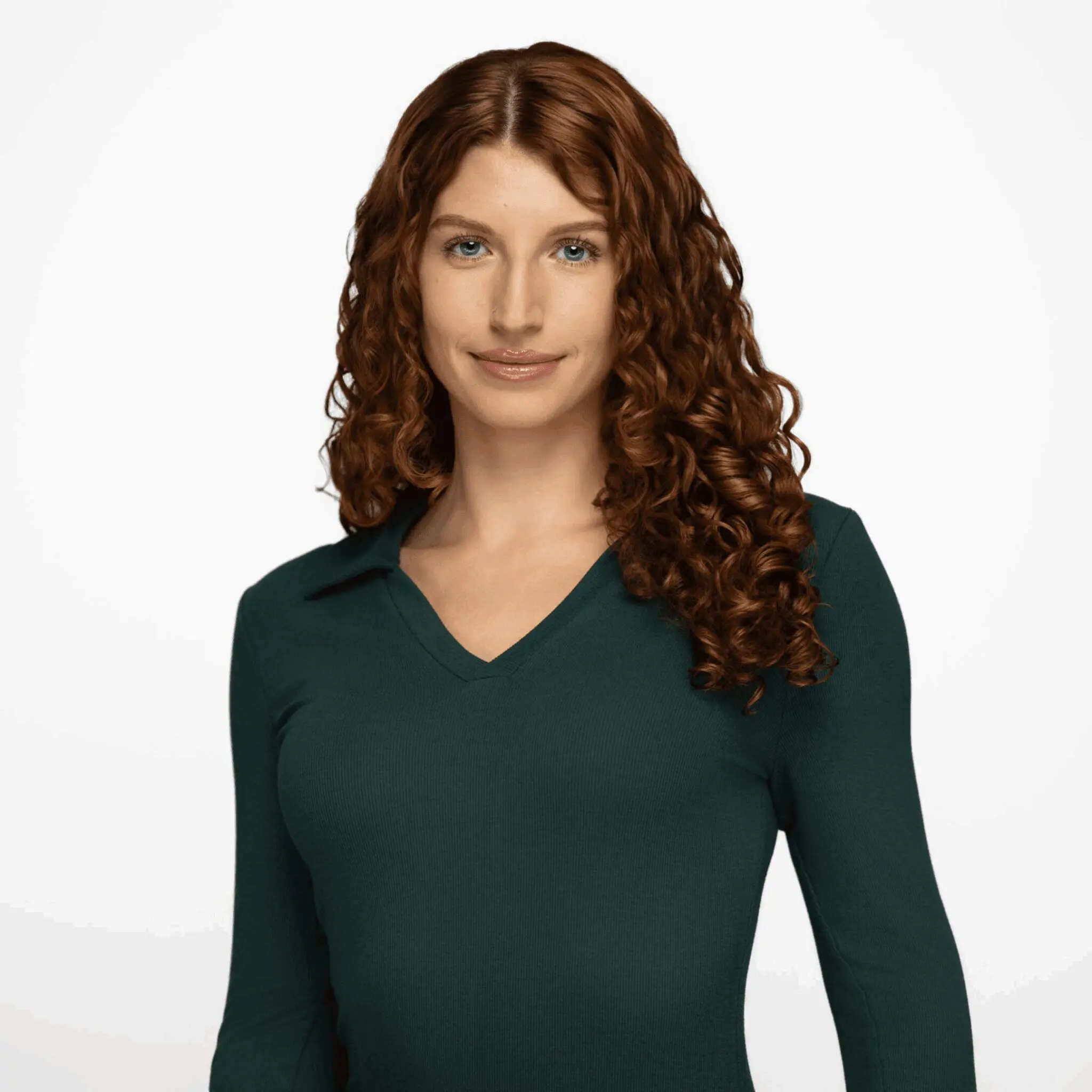 Young woman with curly hair wearing a dark green V-neck top.